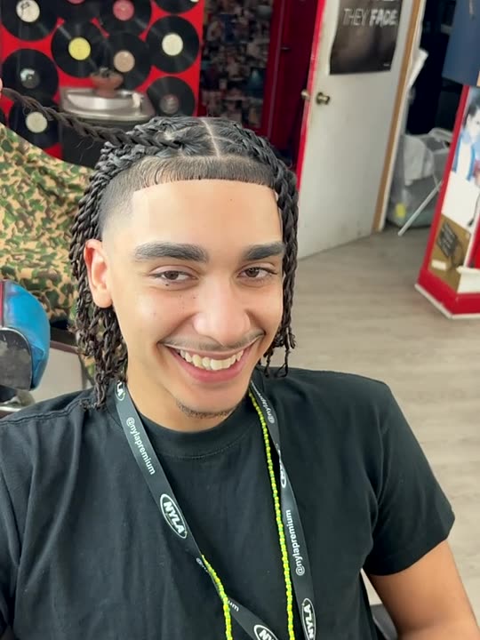 Client smiling after a braid touch up